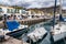 Gran Canaria, Spain - Feb 21, 2023: Colorful canarian fishing boats at the harbor in Puerto de Mogan, Gran Canaria,Spain