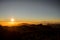 GRAN CANARIA, SPAIN - NOVEMBER 6, 2018: Sunrise from Roque Nublo mountain under the sky in yellow mist and a Tenerife