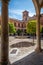 Granada, Spain. October 18th, 2020. Cloister of the Sacromonte Abbey with citrus trees, fountain and colonnade