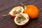 Granadilla fruit on wooden table closeup