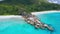 Grand Anse and Petite Anse beaches La Digue Island, Seychelles. Aerial drone circle flight over turquoise crystal clear