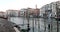 Grand Canal and docks in Venice, public transport boat, clear sky in summer in Italy, nobody