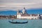 Grand Canal with gondola against Basilica Santa Maria della Salute in Venice, Italy