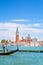 Grand Canal and Gondola, St Mark church tower and turquoise water of canal in Venice, Italy. Summer vacations