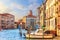 Grand Canal in Venice with its traditional palaces, piers and bo