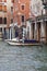 Grand Canal, vintage buildings, parked boats at the marina, Venice, Italy
