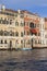 Grand Canal, vintage buildings, parked boats at the marina, Venice, Italy