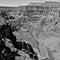 Grand Canyon Arizona, with overhanging lookout in black and white.