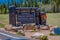 Grand Canyon,Arizona USA, JUNE, 14, 2018: Outdoor view of wooden informative sign and road is bent at an entrance in