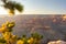 The Grand Canyon is a mesmerizing sight at sunset, where the vibrant, colorful sky meets a blurred yet enchanting foreground
