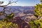 The Grand Canyon is a mesmerizing sight at sunset, where the vibrant, colorful sky meets a blurred yet enchanting foreground