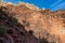 Grand Canyon - Woman hiking along Bright Angel trail with panoramic aerial overlook of South Rim of Grand Canyon, Arizona, USA