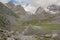 Grand Casse and other mountain peaks along Lac des Vaches, glacial lake in the French Alps