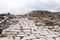 Grand colonnaded street with white marble pavement in ruins of the ancient city Sagalassos lost in Turkey mountains