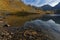 Grand Domenon mountain lake at the first rays of sun