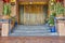 Grand entryway marked by large double wood doors