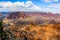 The Grand Grand Canyon from the South Rim framed by a cedar tree, but showing the vastness of the canyon with its meas and buttes