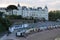 The Grand Hotel and beach huts in different colours in the city Torquay.