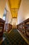 Grand Library Interior with Golden Ceiling and Bookshelves, Low Angle View