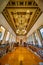 Grand Library Interior with Ornate Ceiling and Bookshelves