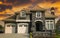 Grand Luxury Home House Maison Rock Stucco Front Exterior Fiery Orange Sunset Sky Background