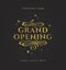 Grand opening - glitter gold logo with flourishes ornamental elements on black background.