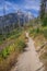 Grand Teton and Mount Owen rise above a hiking path