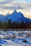 Grand Tetons split rail fence view at alpenglow twilight sunset under lenticular clouds in Grand Tetons National Park in Wyoming