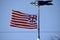 The Grand Union Flag (1775-1777) being flown under a weathervane. Williamsburg, VA, USA. April 11, 2015.
