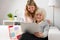 Grandaughter teaching grandma how to use modern computer