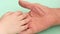 Grandchild and grandfather love and friendship theme.Close-up child`s hand stroking the wrinkled hand of an elderly man, caring fo