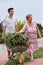 Grandchildren helping grandmother at a home garden