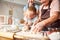 Grandchildren playing with flour at grandma kitchen