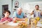 Granddad talking to grandson while sitting at dining table