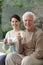 Granddaughter and grandfather sitting