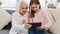 Granddaughter and grandmother with tablet
