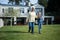 Granddaughter and grandmother waking together in garden