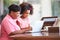 Granddaughter Helping Grandmother With Laptop