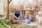 granddaughter helps grandfather cook barbecue on the grill, bonfire