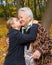 Granddaughter kissing her grandmother