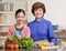 Granddaughter preparing salad with grandmother