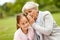 Granddaughter sharing secrets with grandmother