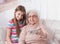 Granddaughter taking selfie with great-grandmother