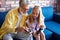 Granddaughter teach grandfather to play videogames