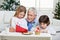 Grandfather Assisting Children In Writing Letters