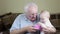 Grandfather and baby girl playing