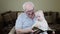 Grandfather and baby girl are reading a book