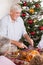 Grandfather carving turkey at christmas