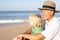 Grandfather with child on beach