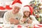 Grandfather and child in Santa hats